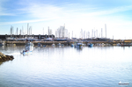 Puerto deportivo de Lagos con barcos amarrados y cielo luminoso del Algarve.