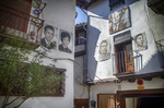 Patio de Mogarraz con retratos murales y casas tradicionales.