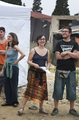 Equipo de Caravan posando junto al escenario móvil tras una intervención teatral.